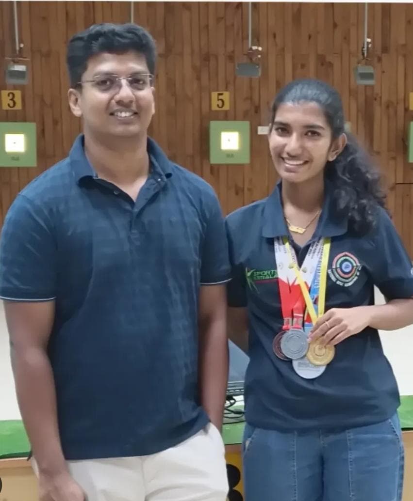 Brahmitha G wearing one gold and two silver medals at the range